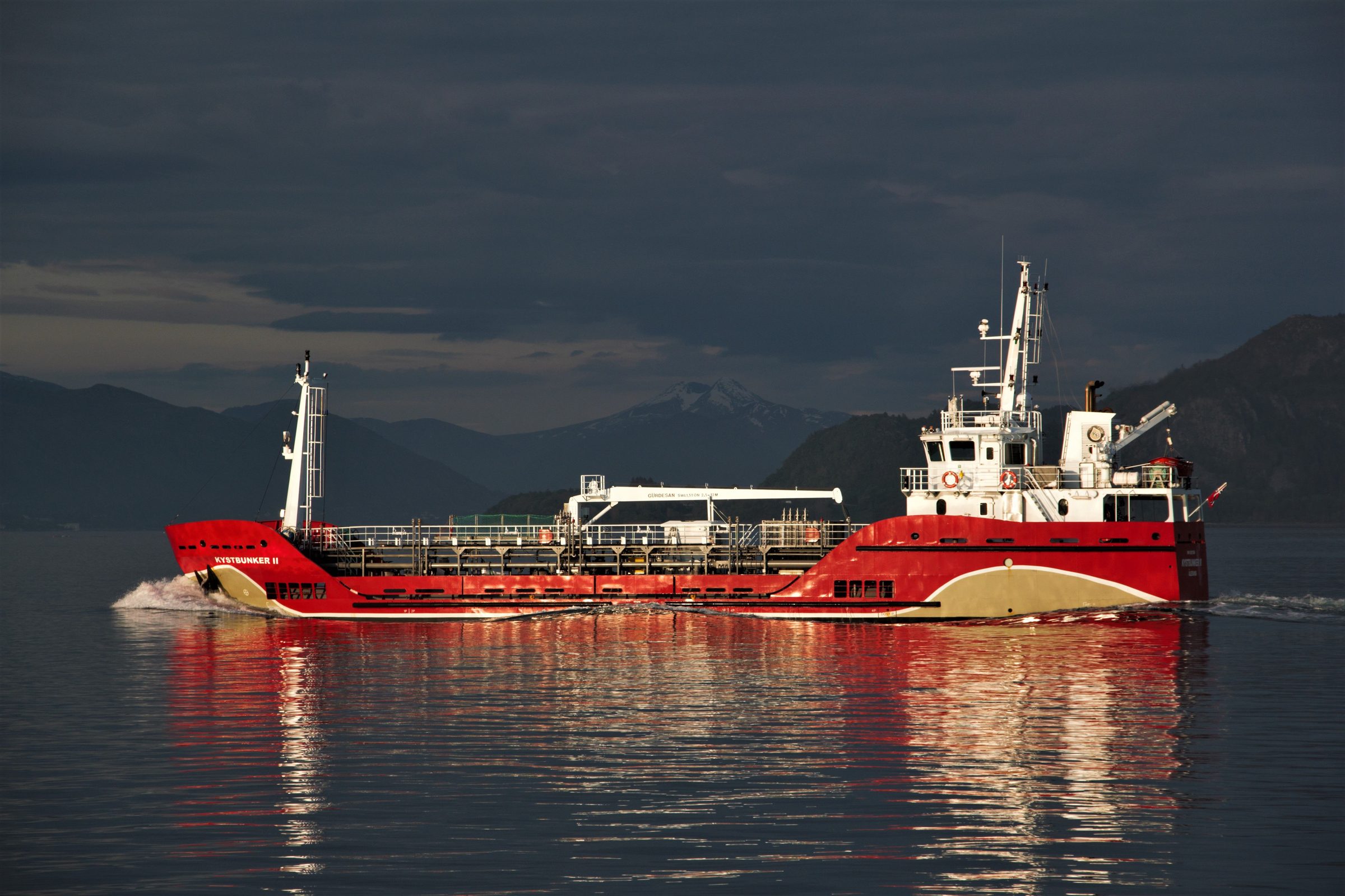 Fuel bunker vessel at dusk on open water