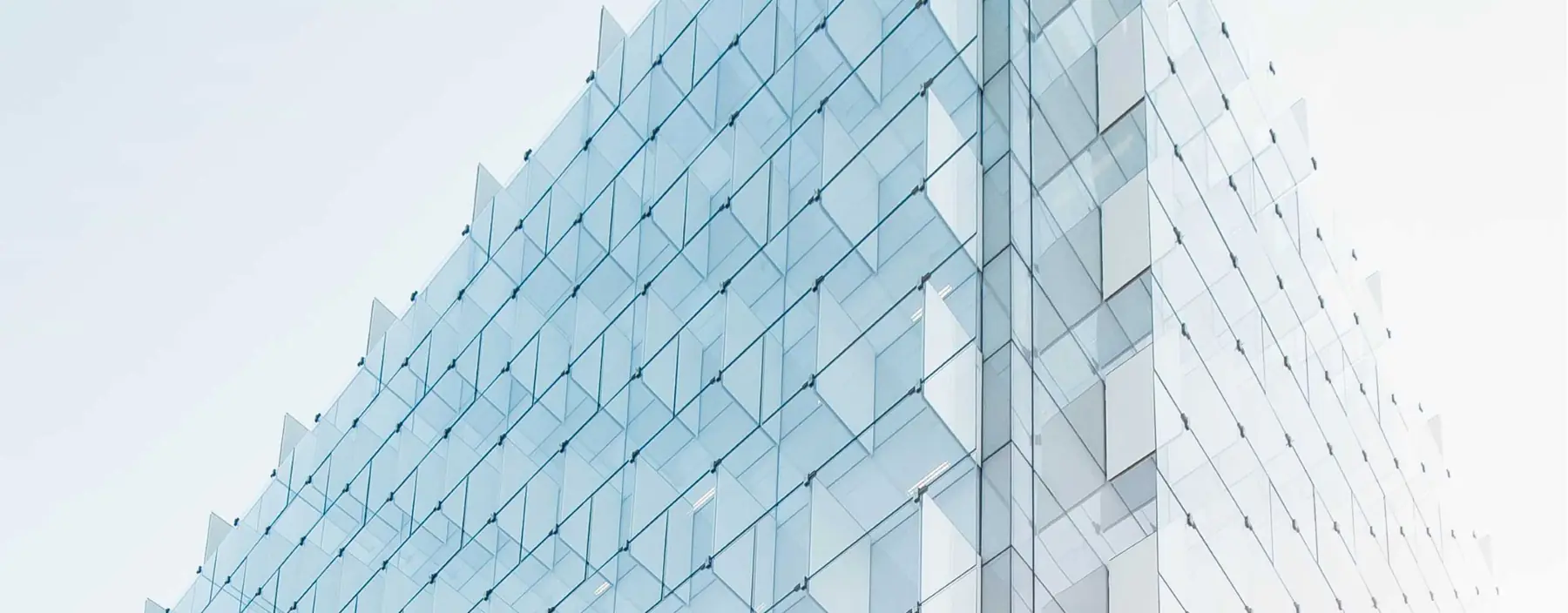 Faceted glass facade of a modern office building